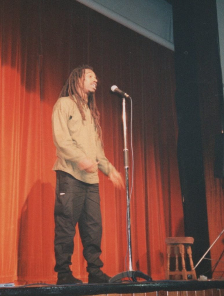 Dr Benjamin Zephaniah performs for the Alchemy Defence Fund event at LSE.
