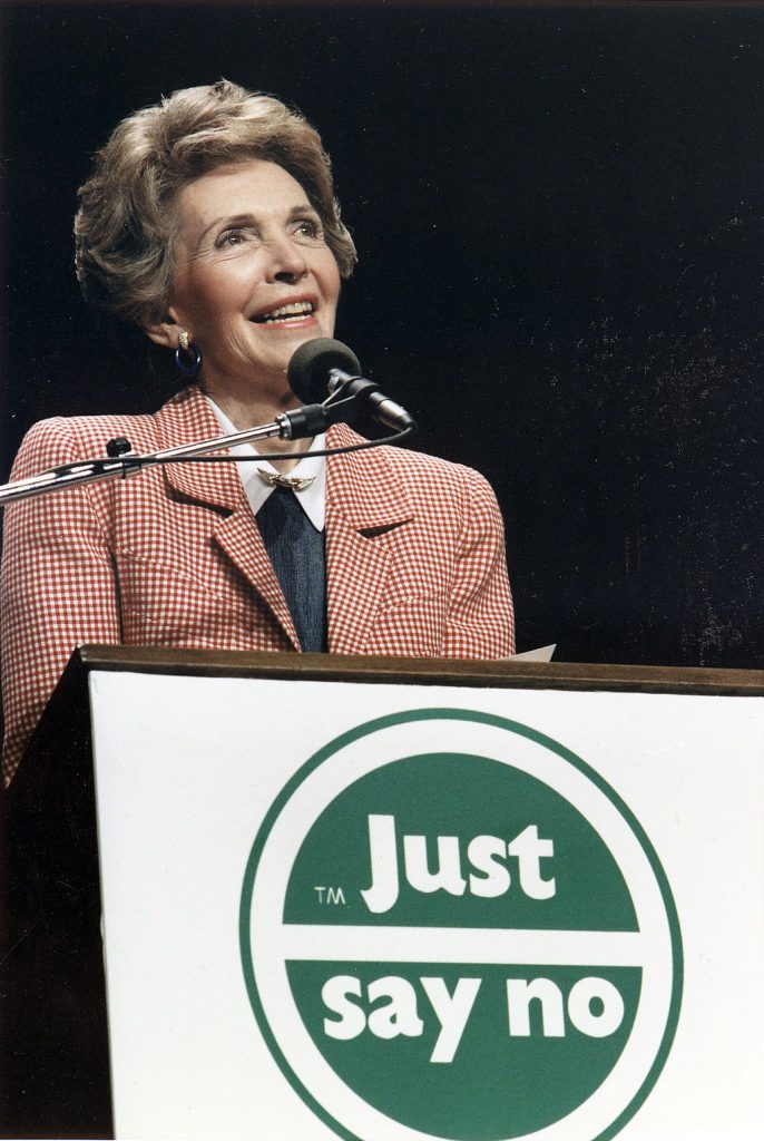 Nancy Reagan posing with just say no logo on podium